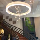 fireplace and staircase with moss artwork