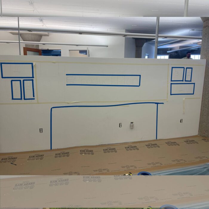 Mockup of moss design including a space for a couch. shown on a small pony wall.